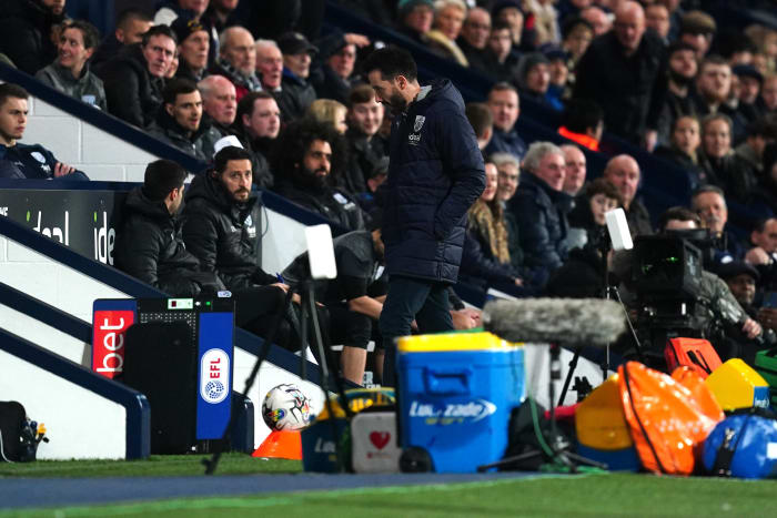 West Bromwich Albion manager Carlos Corberan pictured (center) walking towards the tunnel at The Hawthorns after being sent off during a game against Southampton in February 2024